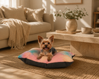 Small dog lying on a colorful pillow in a cozy living room.