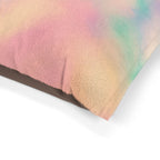 Close-up of a fluffy, multicolored fabric with a gradient effect on a white background.