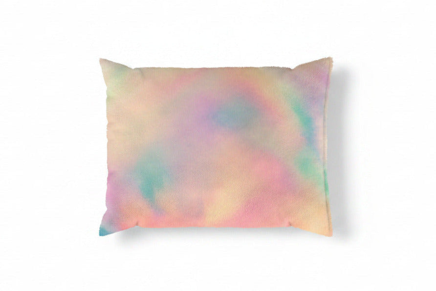 Pastel tie-dye pillow on a white background