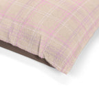 Close-up of a textured fabric with a check pattern on a white background